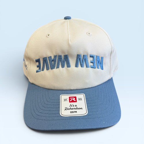 Beige and blue cap with 'New Wave' text on a light blue background