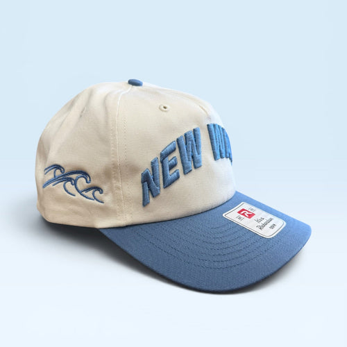 Beige and blue cap with 'NEW' text on a light blue background